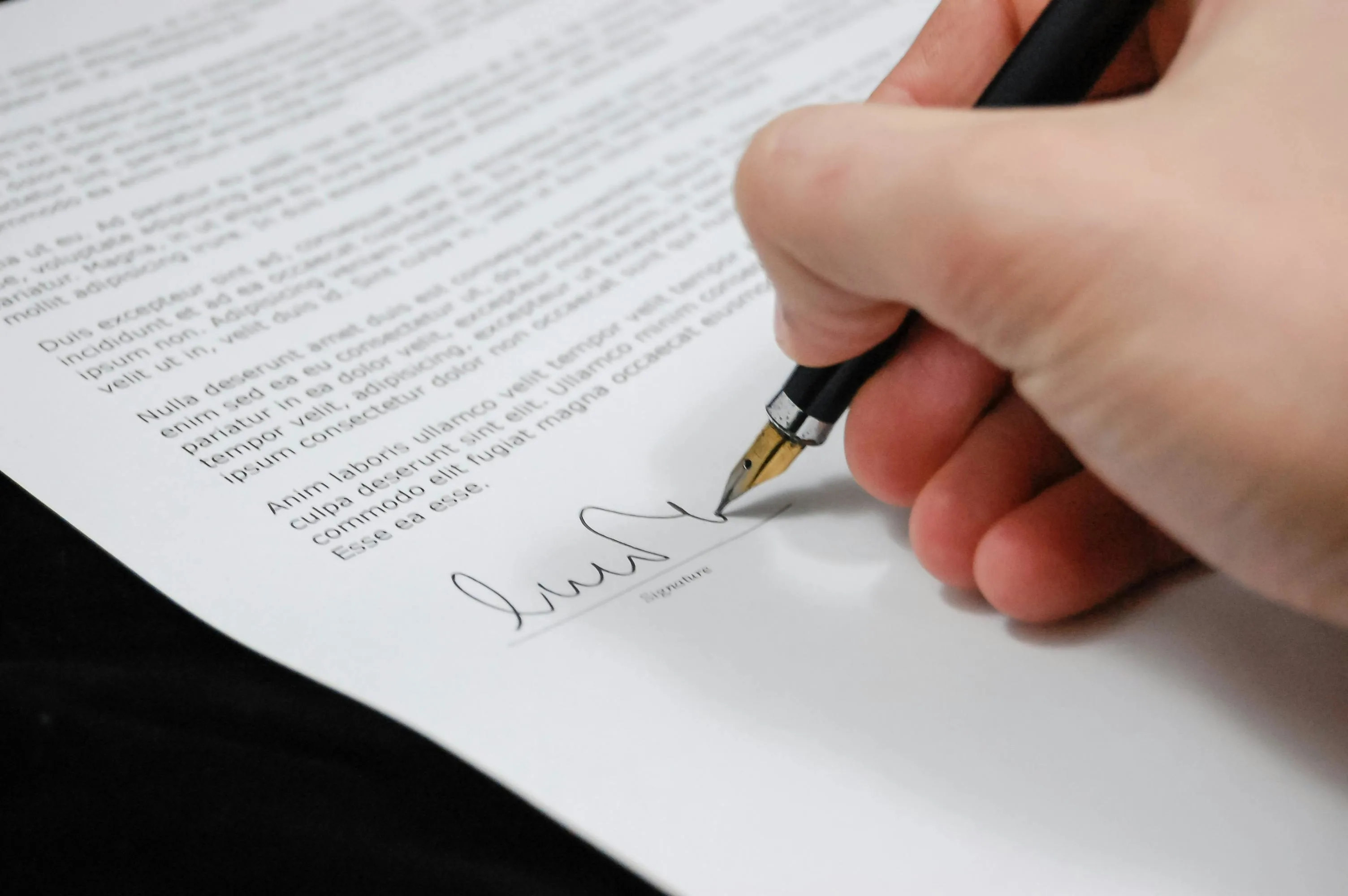documents and a pen on a table